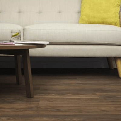 LVT flooring with a simple beige sofa
