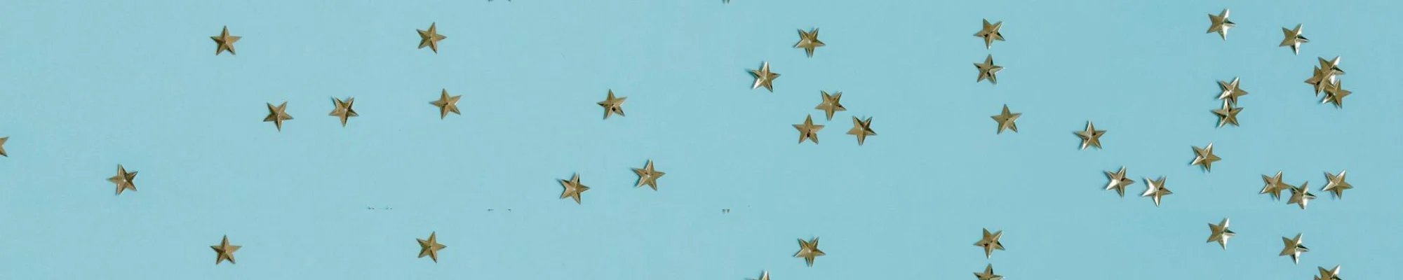 Gold star confetti on a blue background